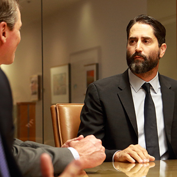 brett t. tolman at conference table