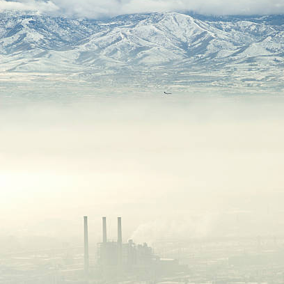 factory haze and mountains